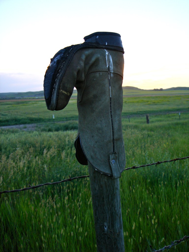 Boot on fence post